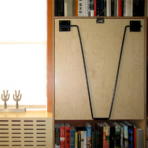 Prefinished plywood drop-down desk with laser-cut plywood radiator cover