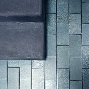 Concrete stair with double glazed ceramic tile floor