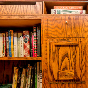 Grain-matched drawer and drop-down stool in Oak cabinet