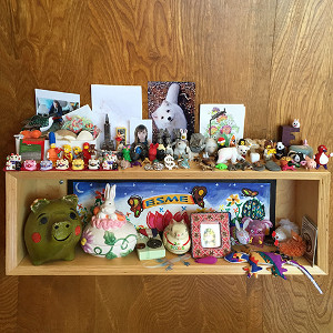 Wall-mounted plywood display box for a girl who really likes collecting
